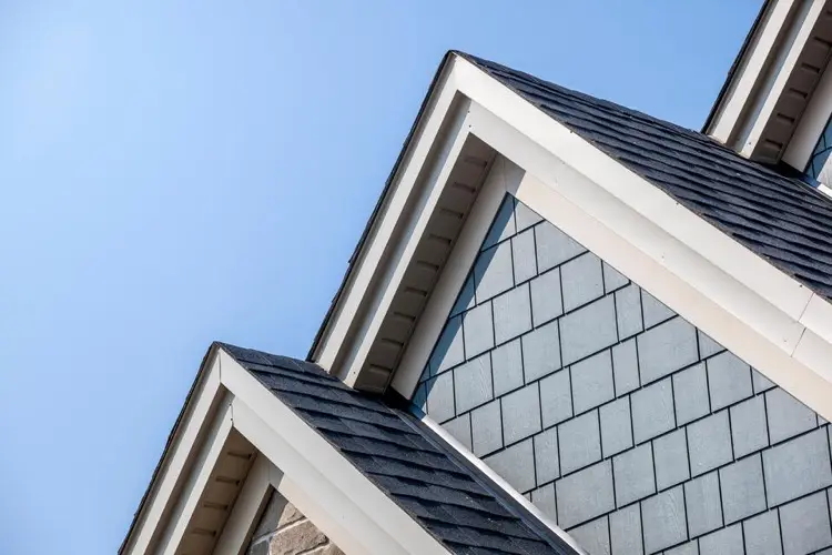 Close up of a house with multiple roof peaks showing ridge lines