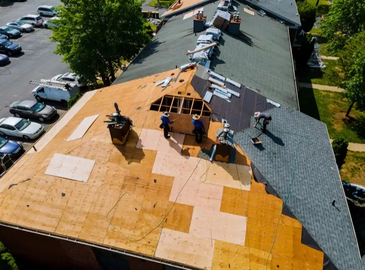 roof-storm-damage-aerial-view-of-roofing-team-replacing-a-roof