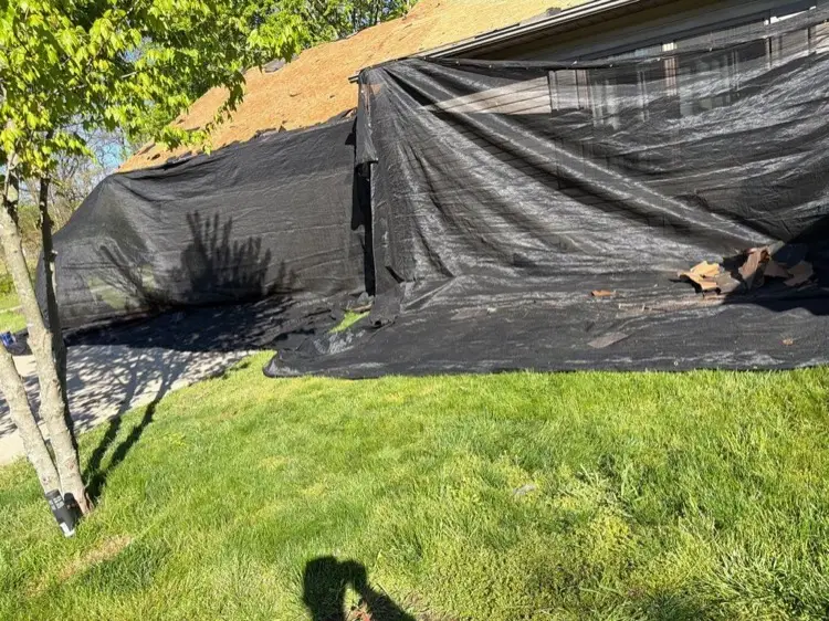 Catch-all netting protecting the side of a house and garden during tear-off in Jones Michigan