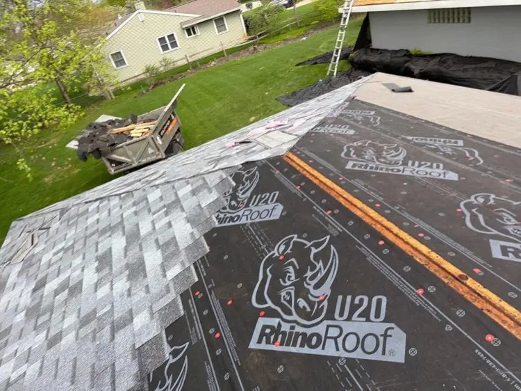 Synthetic underlayment dried in on a roof deck with new shingles being installed in Elkhart Indiana