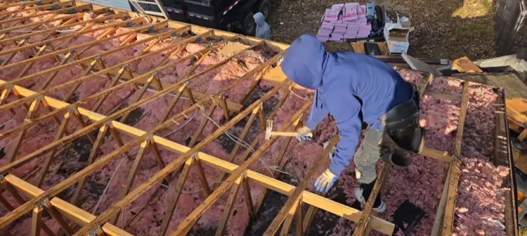 Damaged OSB roof sheeting exposed during tear-off