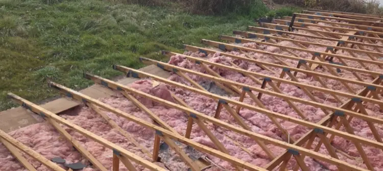 Rotted plank board roof decking requiring replacement