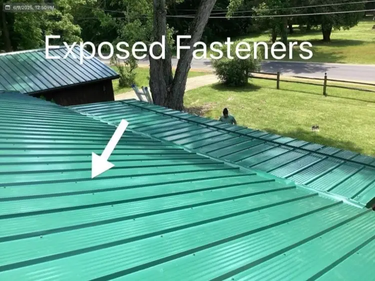 Exposed fastener metal roof panels on a residential property