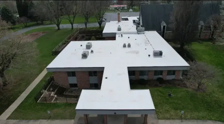 Aerial view of a white commercial membrane roof in Northern Indiana