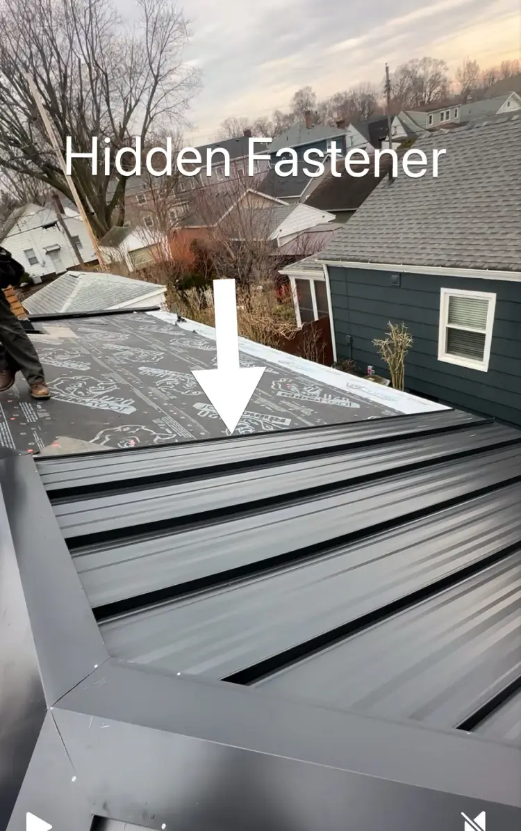 Exposed fastener metal roof panels with rows of screws visible on the face, the part that needs checking over the years