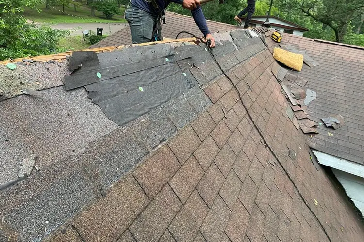 Better Way Roofing crew tearing off a worn asphalt shingle roof on a Lagrange Indiana home