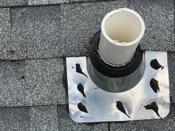 Pipe boot flashing sealed around a plumbing vent on an asphalt shingle roof in Bristol Indiana