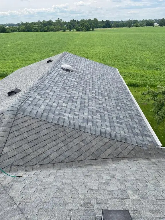 The same Shipshewana roof after sectional repair with new architectural shingles and vent
