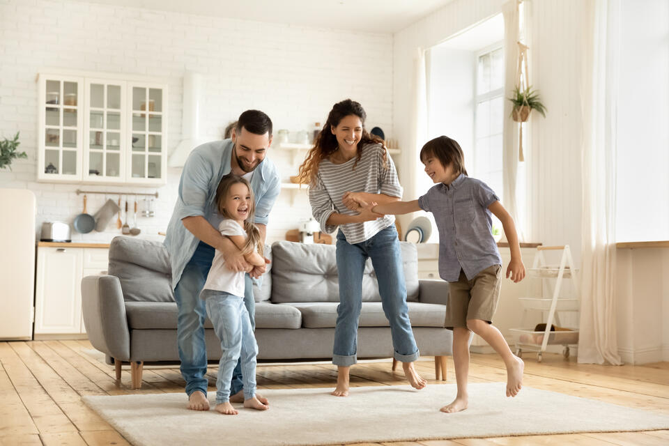 happy family of 4 in a house