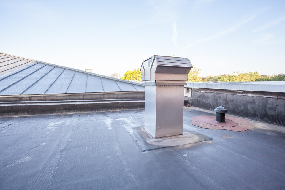 dark commercial roofing with vents